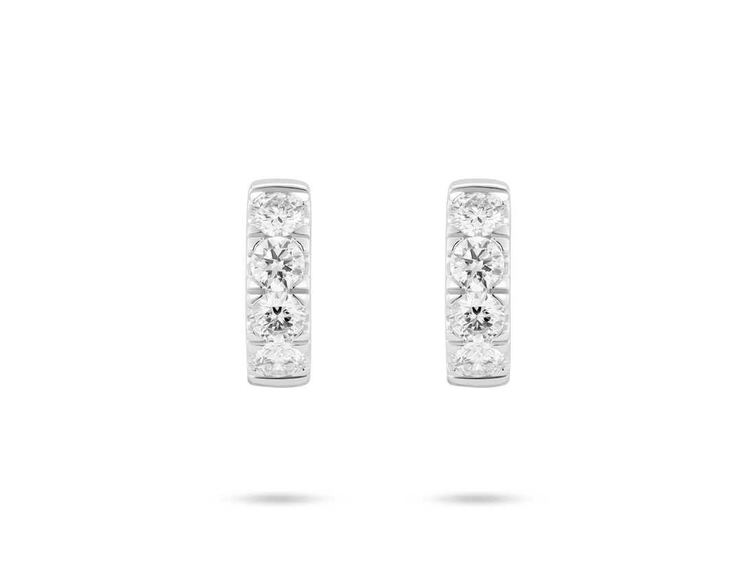 Front view of 0.8 carat total weight pavé huggie hoops in 14k white gold