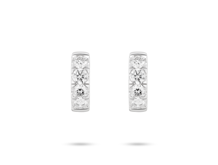 Front view of 0.8 carat total weight pavé huggie hoops in 14k white gold