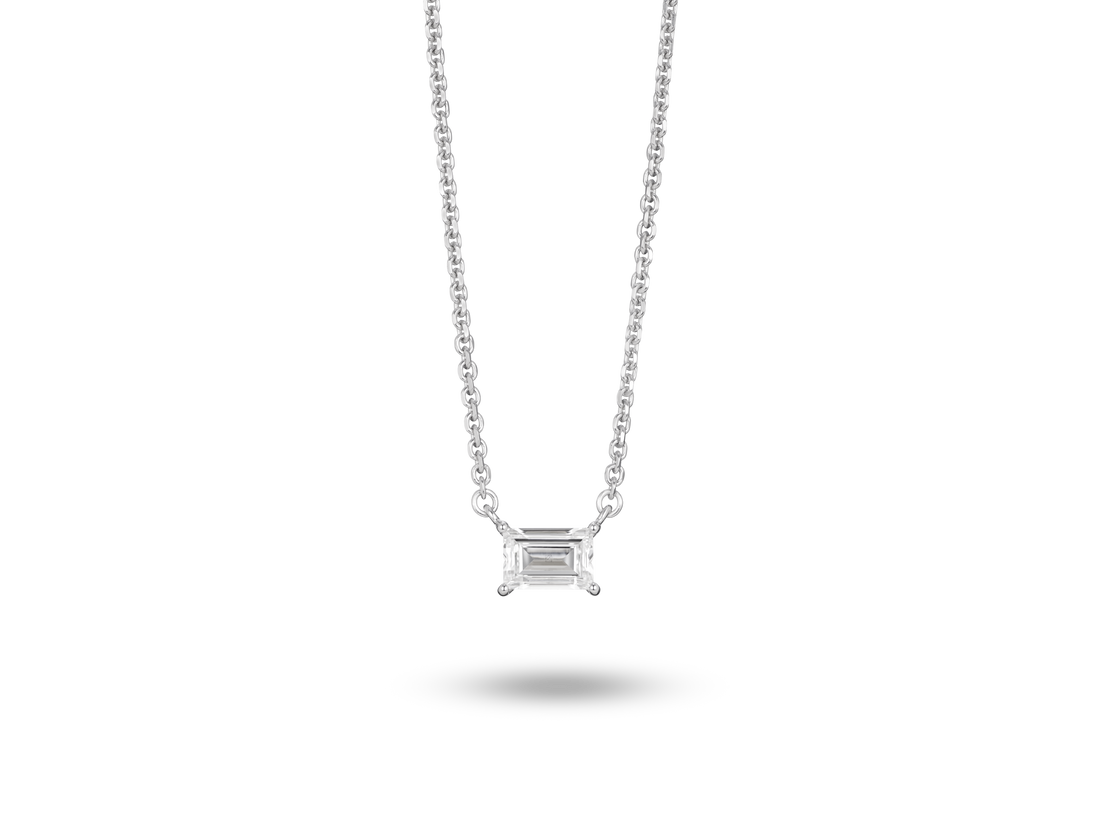 Front view of 0.25 carat baguette cut solitaire pendant in white gold